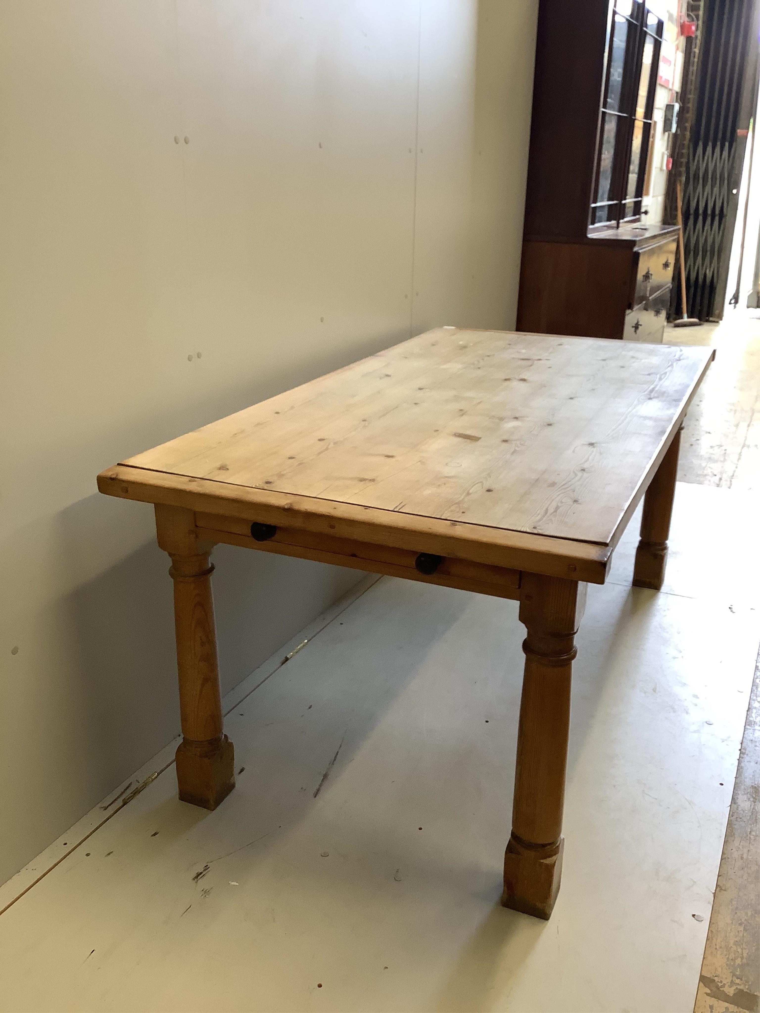 A rectangular pine refectory dining table, width 183cm, depth 89cm, height 77cm. Condition - fair